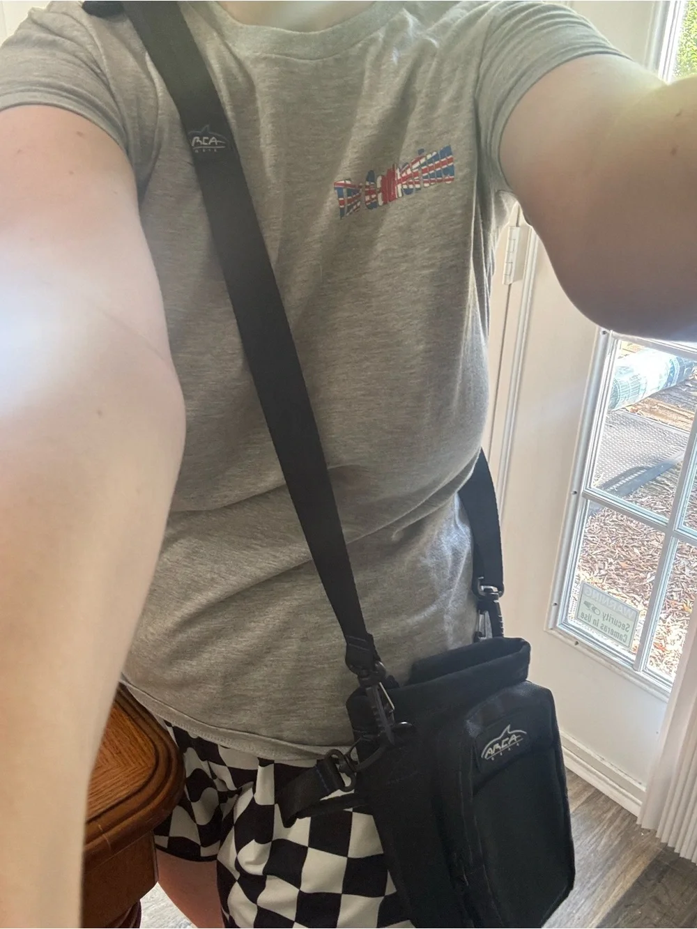 Black and blue water bottle crossbody